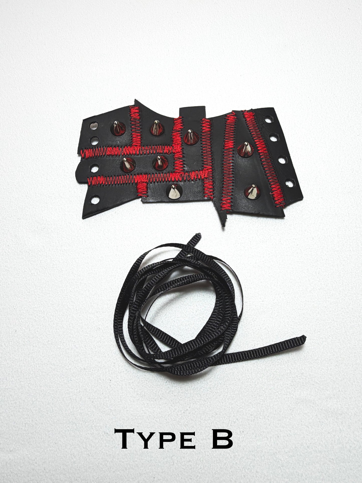 Pieced together corset cuffs (red seam)