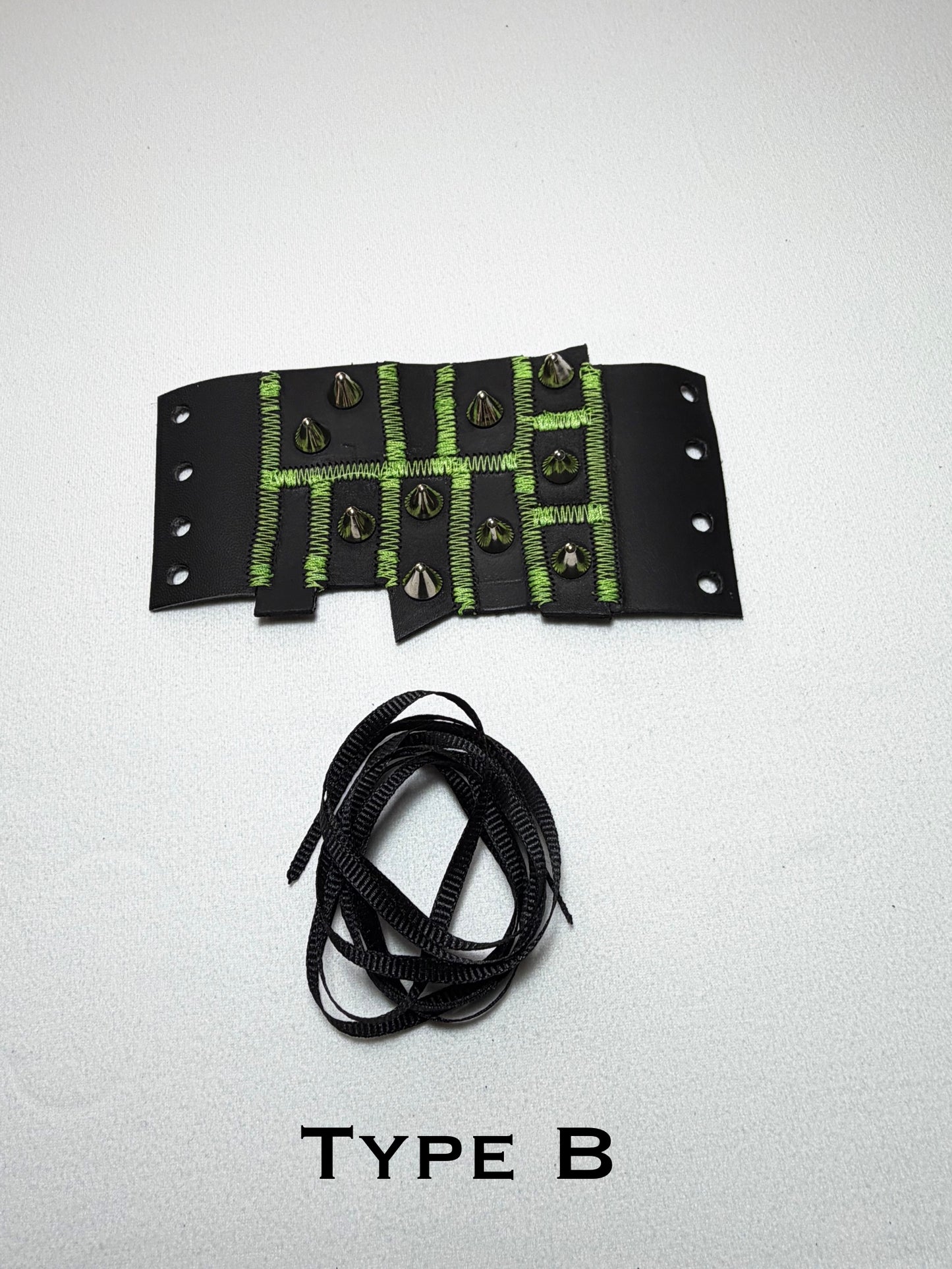 Pieced together corset cuffs (green seam)