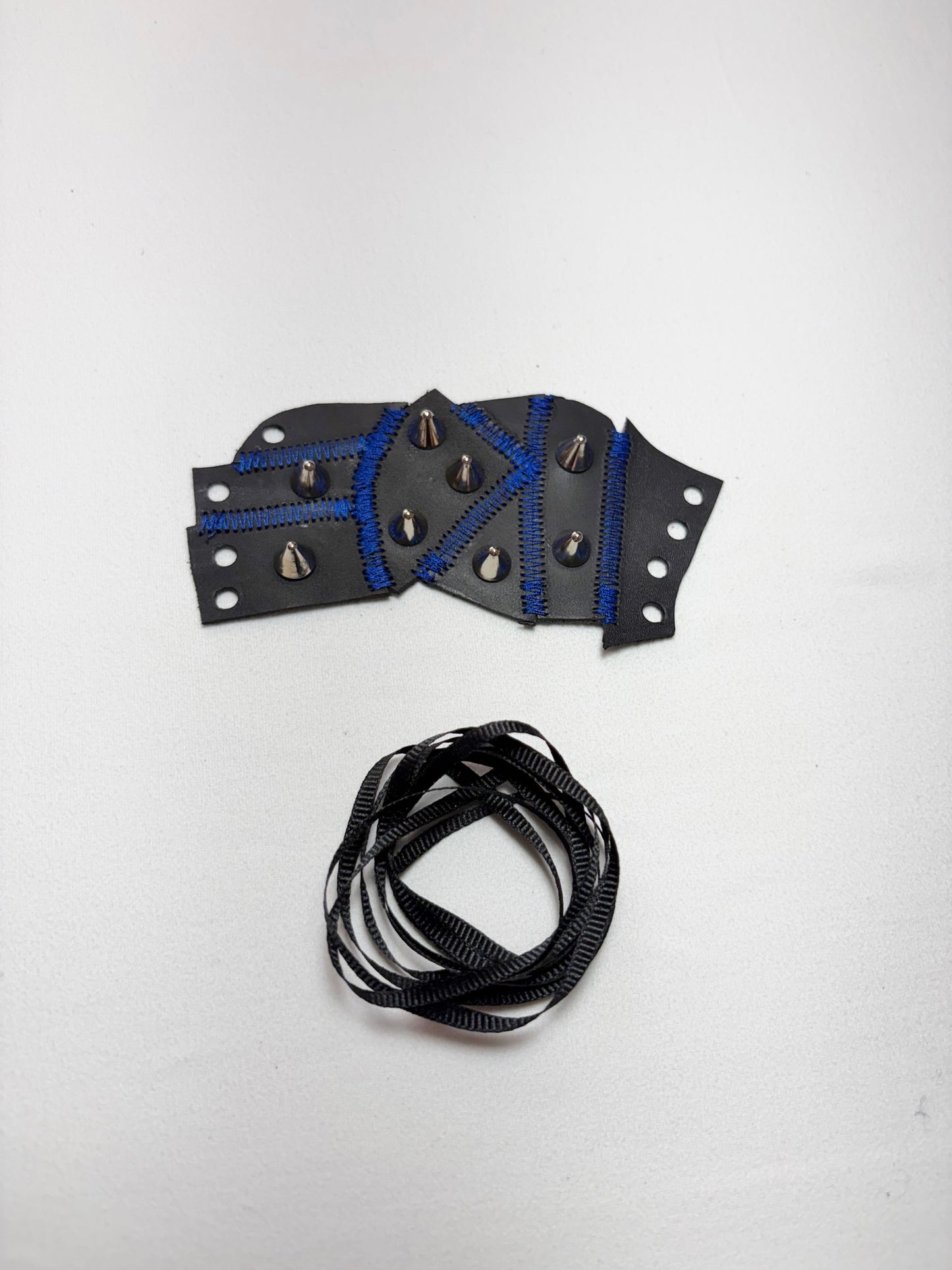 Pieced together corset cuffs (blue seam)