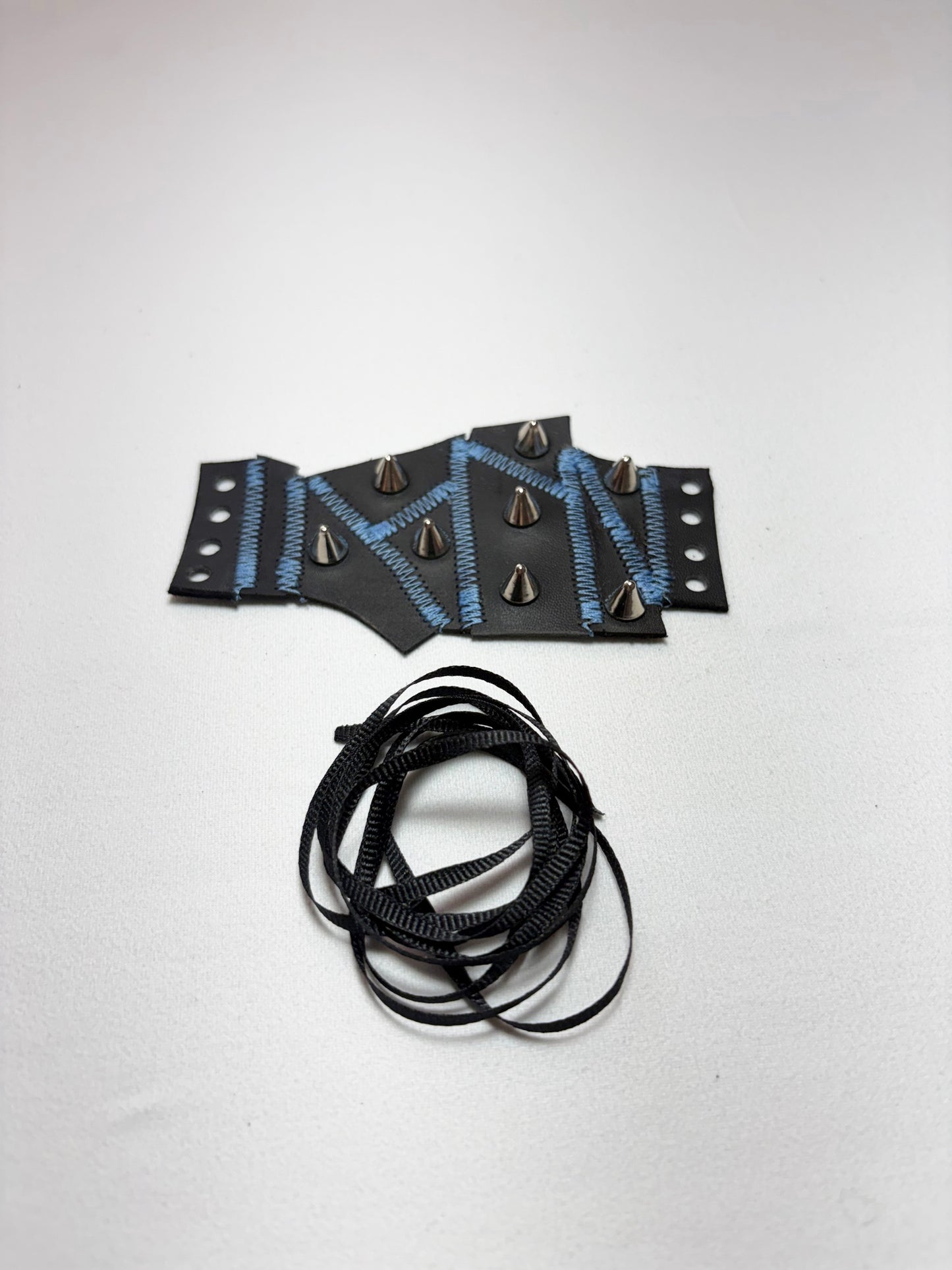 Pieced together corset cuffs (blue seam)