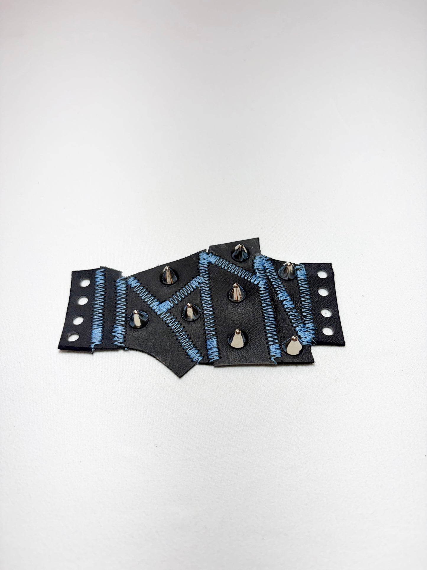 Pieced together corset cuffs (blue seam)