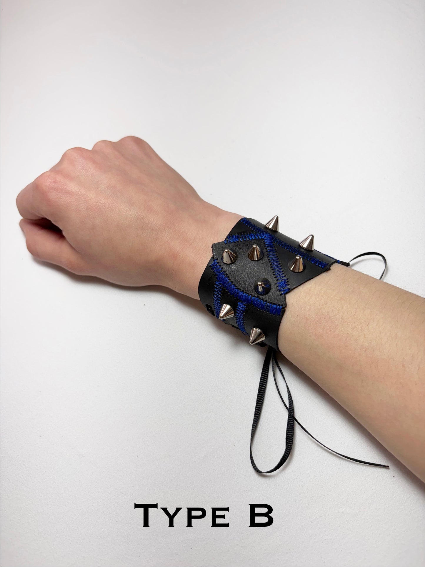 Pieced together corset cuffs (blue seam)